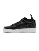 Black sneaker with white sole on a white background